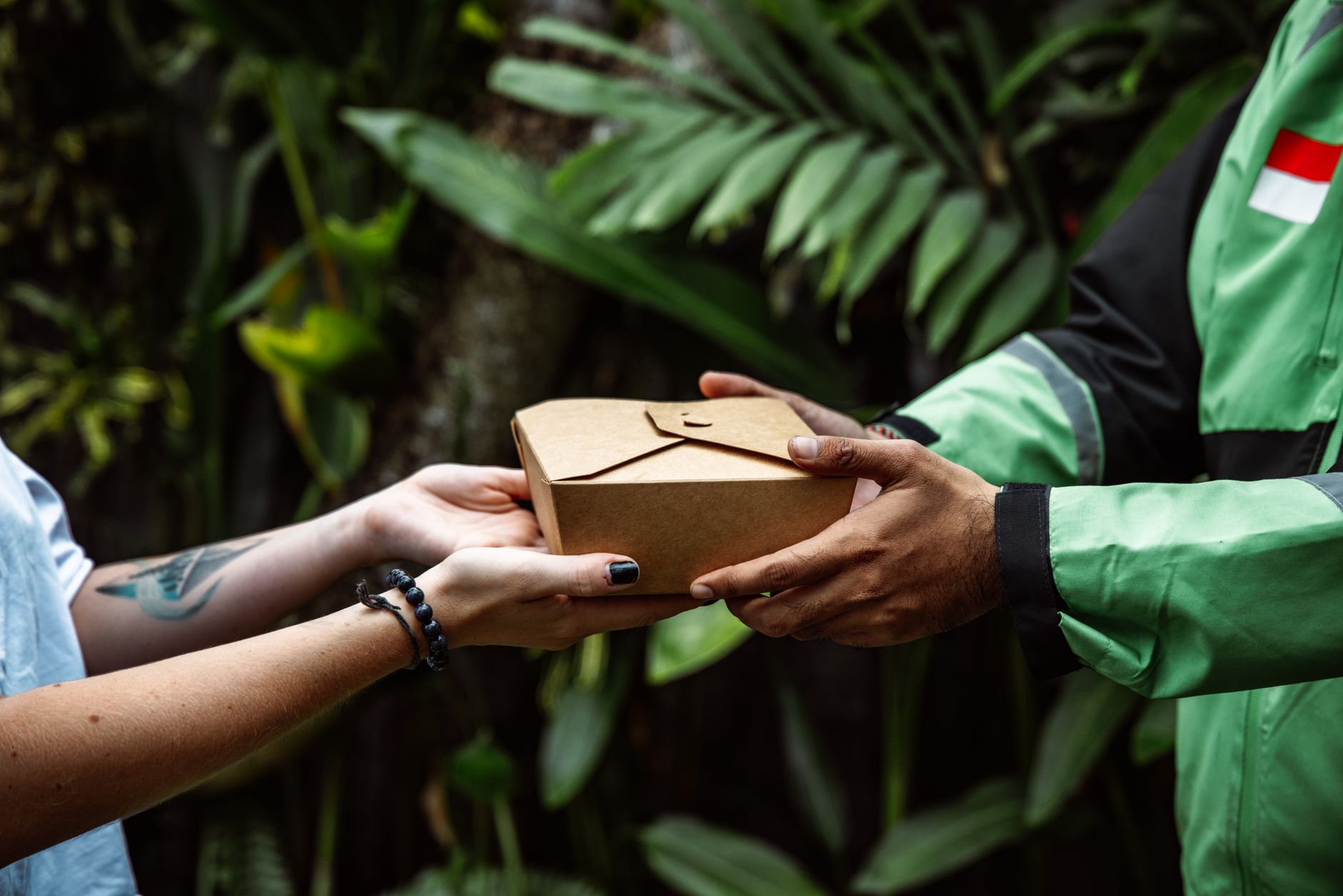 Eco-friendly food delivery service in a natural setting with a package exchange.